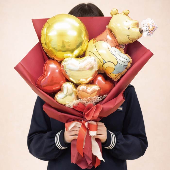 卒業を祝うキャラクターバルーンのブーケ